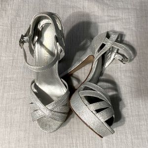 Silver high heels. Worn for approximately 6 hours to a wedding.